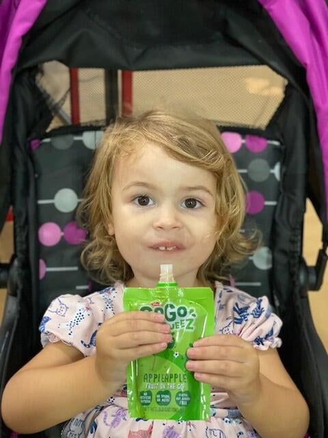 Child holding a GoGo Squeeze